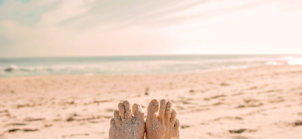 toe tapping at the beach to release energy and calm the mind